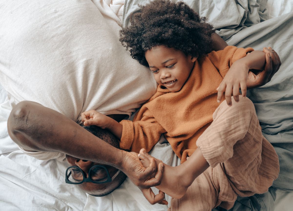 A pediatrician talking with a parent and child